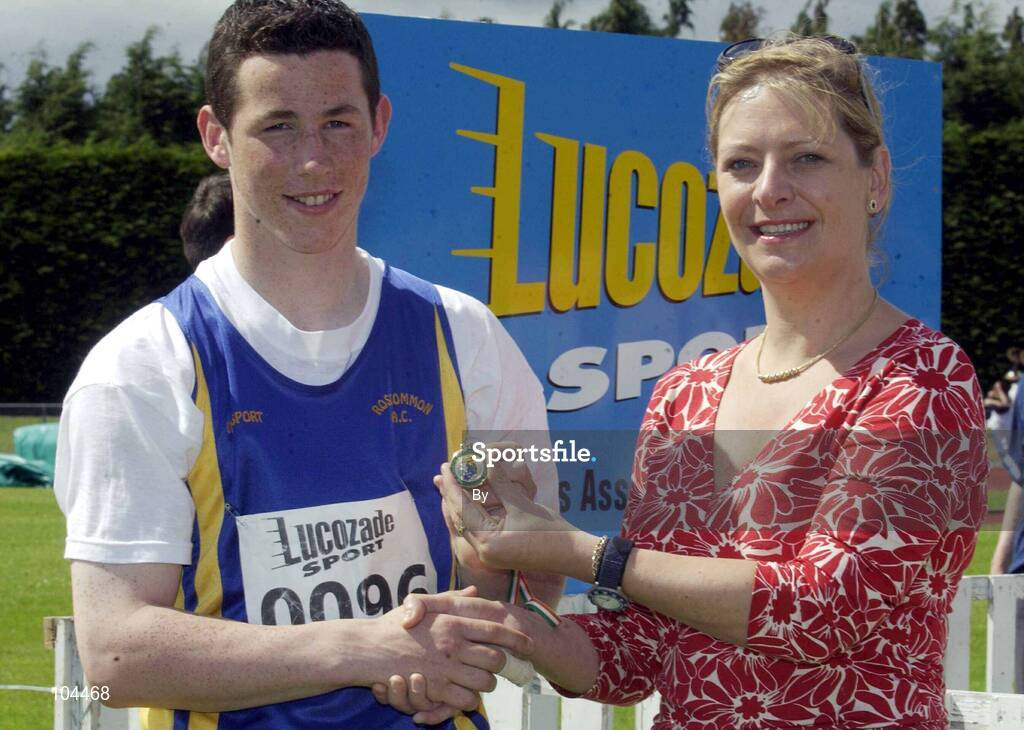 27th July 2002; Winner of the U.18 Javlin event Rikki O'Gara, Roscommon AC, is presented with the Gold Medal by Rosemary Lyster, Marketing Manager, Lucozade Sport, at the Lucozade Sport AAI Juvenile Track & Field Championship of Ireland 2002, Tullamore Harriers Stadium, Tullamore, Co. Offaly. Athletics. Picture credit; Ray McManus / SPORTSFILE *EDI*