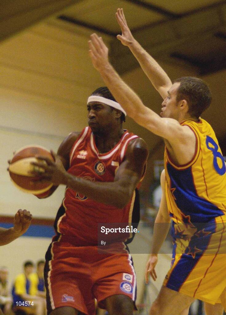 22 December 2002; Kenny Gamble, Neptune, in action against David Donnelly, ITP Saints. ESB Superleague Basketball, Neptune v Irish Travel Partners St. Vincent's, Neptune Stadium, Cork. Picture credit; Brendan Moran / SPORTSFILE *EDI*