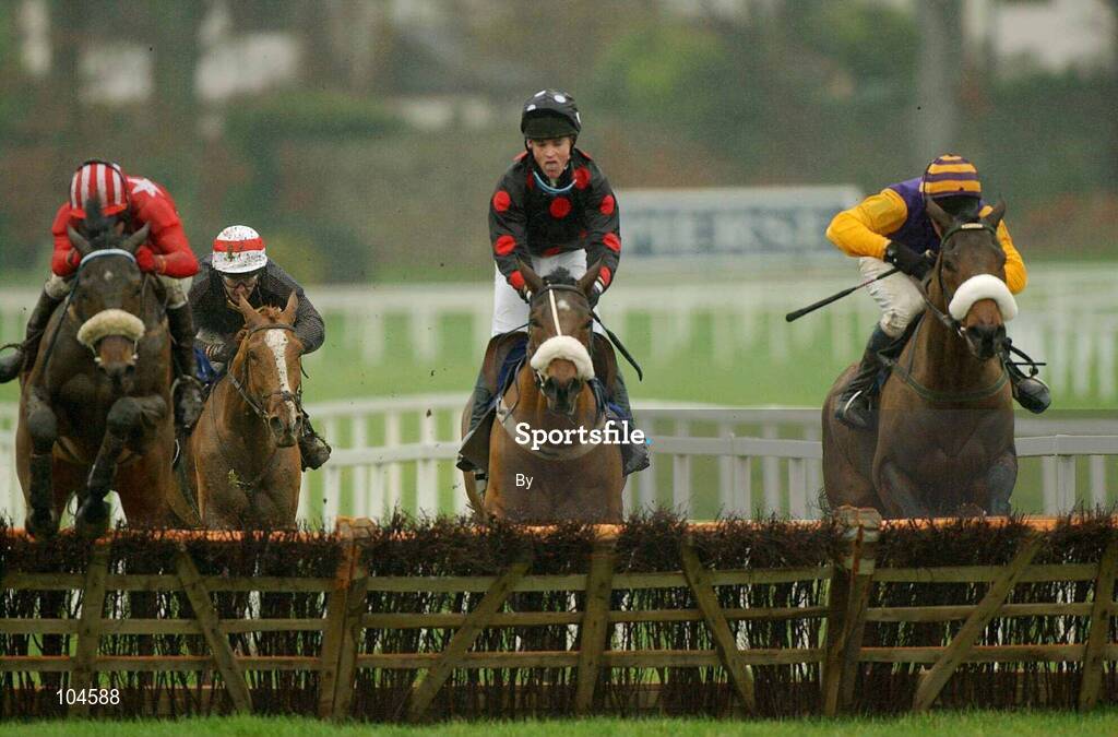 26 December 2002; Party Airs, left, with Barry Geraghty up, jumps the last ahead of Kenilworth, with Joey Elliot up, and Harchibald, right, with Paul Carberry up, on their way to win The Denny Juvenile Hurdle, Leopardstown Racecourse, Foxrock, Co. Dublin. Horse racing . Picture credit; Ray McManus / SPORTSFILE *EDI*