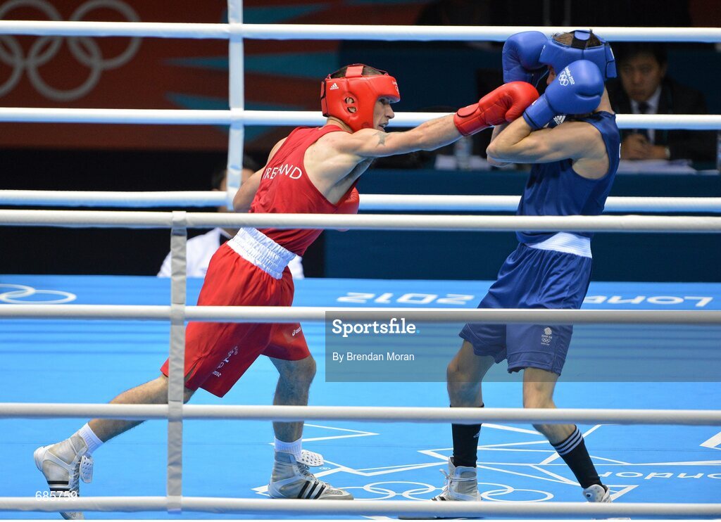 11 August 2012; John Joe Nevin, Ireland, exchanges punches with Luke Campbell, Great Britain, during their men's bantam 56kg final contest. London 2012 Olympic Games, Boxing, South Arena 2, ExCeL Arena, Royal Victoria Dock, London, England. Picture credit: Brendan Moran / SPORTSFILE