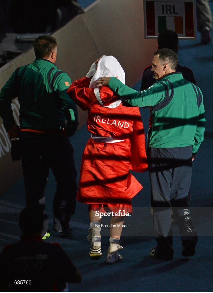 11 August 2012; John Joe Nevin, Ireland, is consoled by team coach Billy Walsh after being defeated in his men's bantam 56kg final contest. London 2012 Olympic Games, Boxing, South Arena 2, ExCeL Arena, Royal Victoria Dock, London, England. Picture credit: Brendan Moran / SPORTSFILE