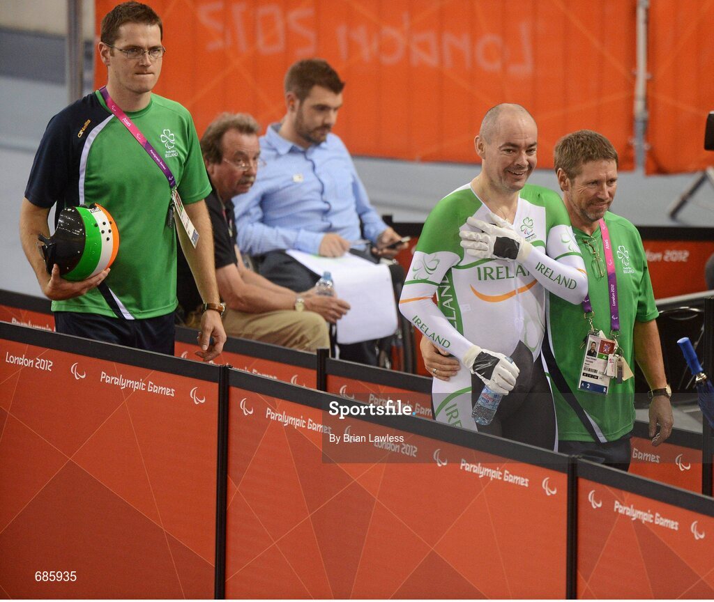 30 August 2012; Ireland's Enda Smyth, from Santry, Dublin, with team manager Denis Toomey, from Mitchelstown, Cork, and coach Brian Nugent, from Cookstown, Dublin, left, after competing in the final of the men's individual 1km C3 time trial. London 2012 Paralympic Games, Cycling, Velodrome, Olympic Park, Stratford, London, England. Picture credit: Brian Lawless / SPORTSFILE