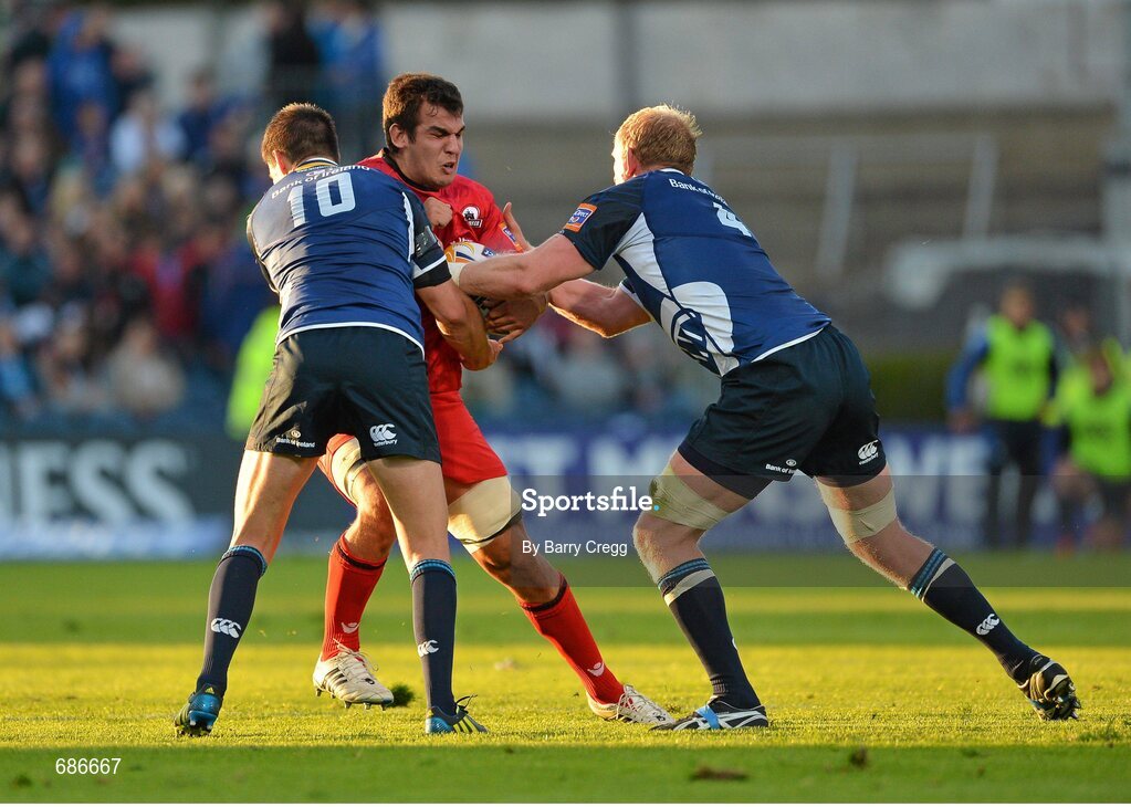 22 September 2012; Stuart McInally, Edinburgh, is tackled by Jonathan Sexton, left, and Leo Cullen, Leinster. Celtic League 2012/13, Round 4, Leinster v Edinburgh, RDS, Ballsbridge, Dublin. Picture credit: Barry Cregg / SPORTSFILE