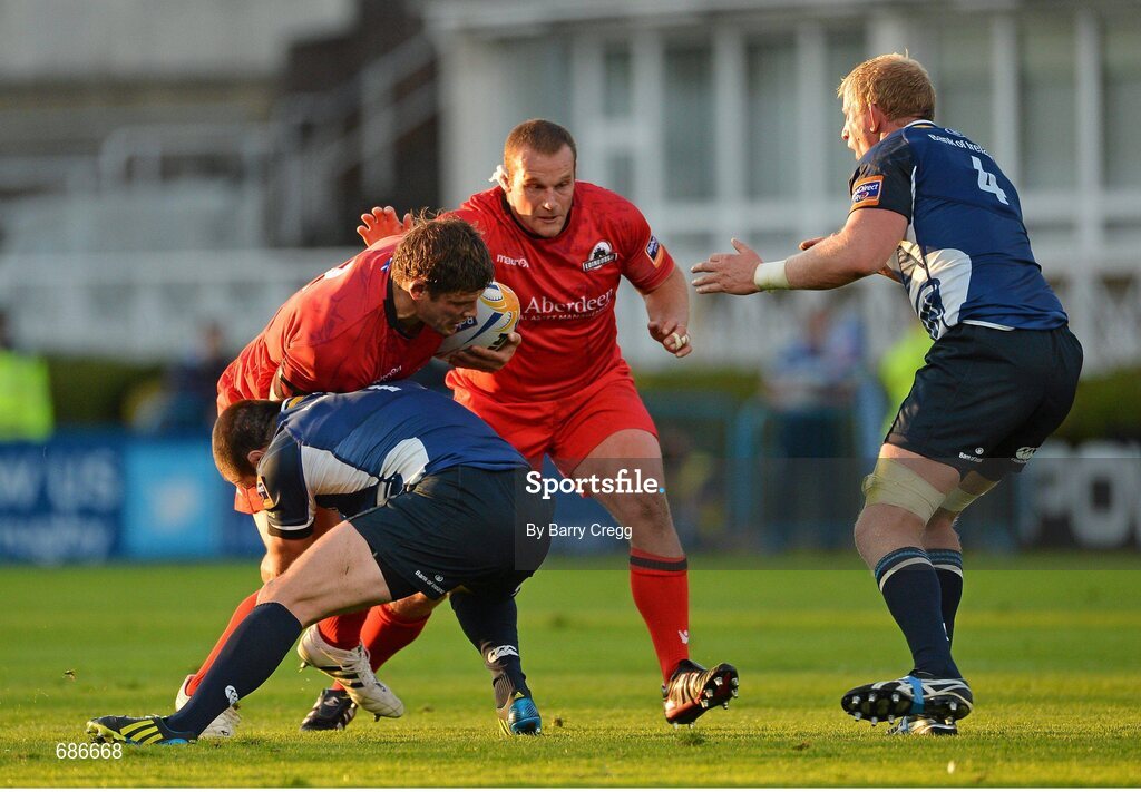 22 September 2012; Ross Ford, Edinburgh, with support from team mate Geoff Cross, is tackled by Shane Jennings, left, Leinster, with support from team mate Leo Cullen. Celtic League 2012/13, Round 4, Leinster v Edinburgh, RDS, Ballsbridge, Dublin. Picture credit: Barry Cregg / SPORTSFILE