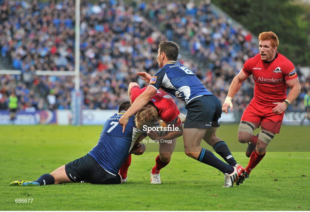 22 September 2012; Greig Tonks, Edinburgh, is tackled by Shane Jennings, left, and Jamie Heaslip, Leinster. Celtic League 2012/13, Round 4, Leinster v Edinburgh, RDS, Ballsbridge, Dublin. Picture credit: Barry Cregg / SPORTSFILE