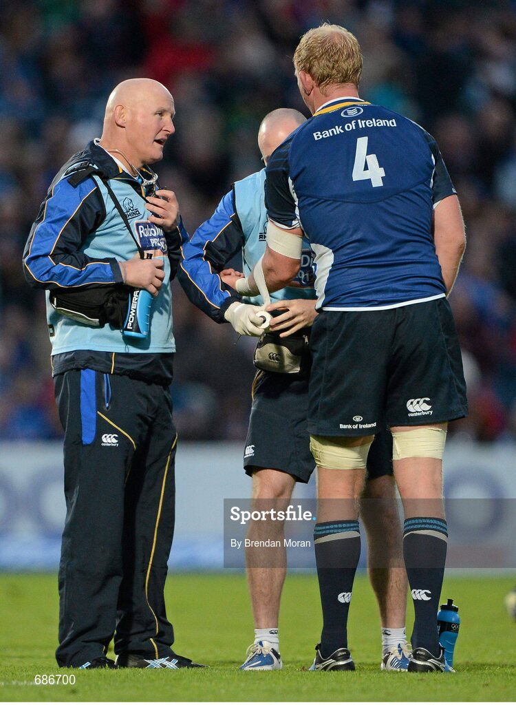 22 September 2012; Leinster's Leo Cullen has his arm strapped up, watched by Leinster team doctor Dr. Jim McShane, left. Celtic League 2012/13, Round 4, Leinster v Edinburgh, RDS, Ballsbridge, Dublin. Picture credit: Brendan Moran / SPORTSFILE