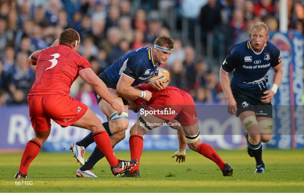 22 September 2012; Jamie Heaslip, Leinster, with support from team-mate Leo Cullen is tackled by Geoff Cross, left, and Roddy Grant, Edinburgh. Celtic League 2012/13, Round 4, Leinster v Edinburgh, RDS, Ballsbridge, Dublin. Picture credit: Stephen McCarthy / SPORTSFILE