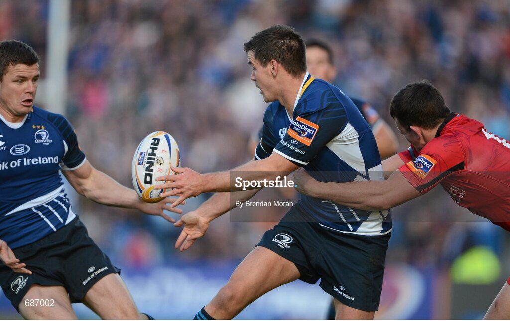 22 September 2012; Jonathan Sexton, Leinster, passes to team-mate Brian O'Driscoll despite the tackle of Matt Scott, Edinburgh. Celtic League 2012/13, Round 4, Leinster v Edinburgh, RDS, Ballsbridge, Dublin. Picture credit: Brendan Moran / SPORTSFILE