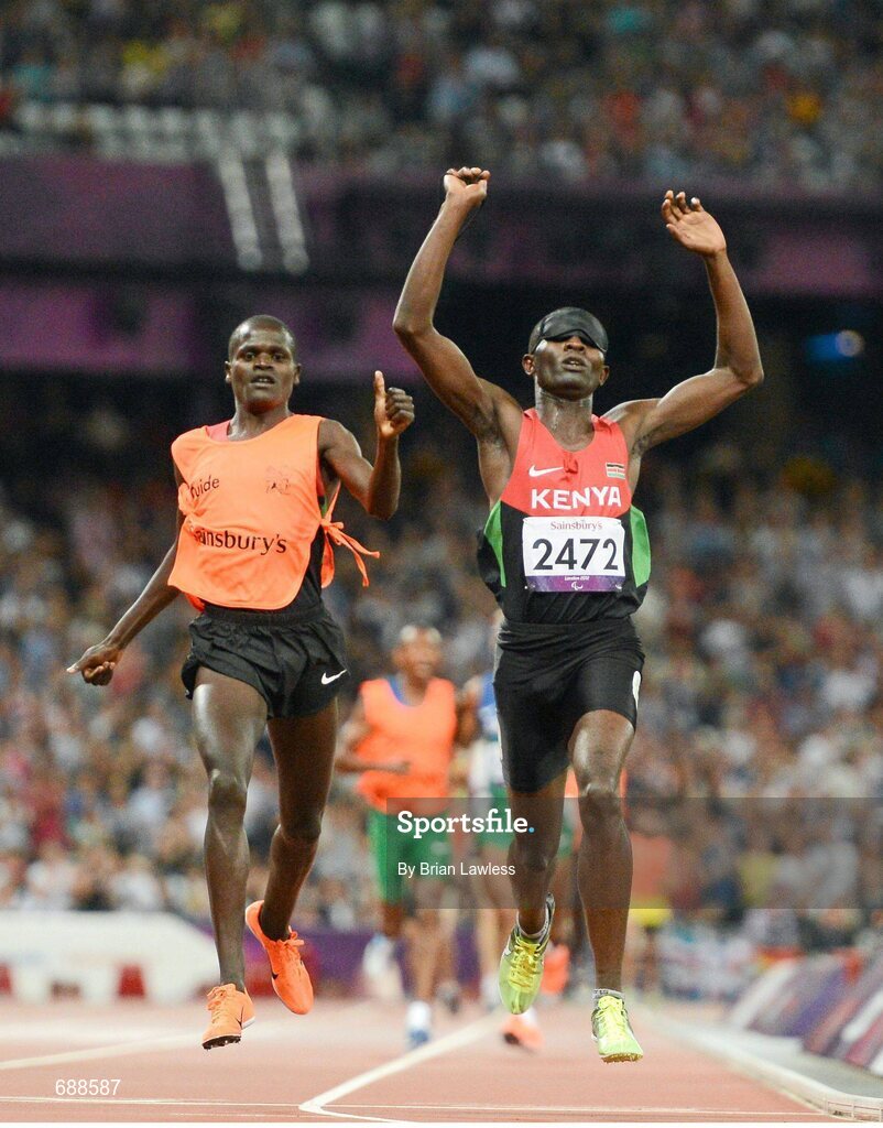 3 September 2012; Samwel Mushai Kimani, Kenya, and his guide James Boit, celebrate winning the Men's 1500m - T11 in a World record time of 3:58.37. London 2012 Paralympic Games, Athletics, Olympic Stadium, Olympic Park, Stratford, London, England. Picture credit: Brian Lawless / SPORTSFILE