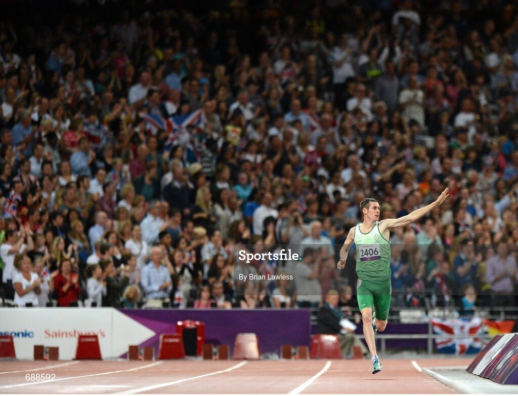 3 September 2012; Ireland's Michael McKillop, from Newtownabbey, Co. Antrim, right, acknowleges the supporters on his way to winning the men's 1500m - T37 final in a time of 4.08:11. London 2012 Paralympic Games, Athletics, Olympic Stadium, Olympic Park, Stratford, London, England. Picture credit: Brian Lawless / SPORTSFILE