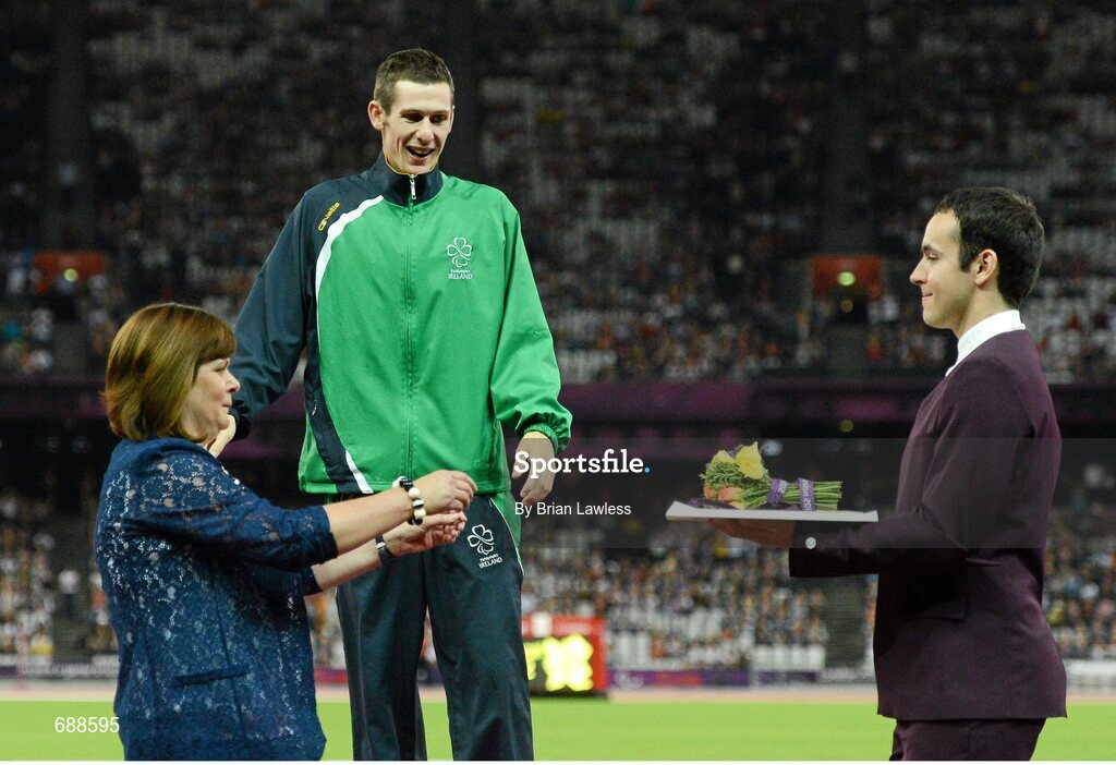 3 September 2012; Ireland's Michael McKillop, from Newtownabbey, Co. Antrim, celebrates as his mother Catherine makes her way to present him with his gold medal after he won the men's 1500m - T37 final in a time of 4.08:11. London 2012 Paralympic Games, Athletics, Olympic Stadium, Olympic Park, Stratford, London, England. Picture credit: Brian Lawless / SPORTSFILE
