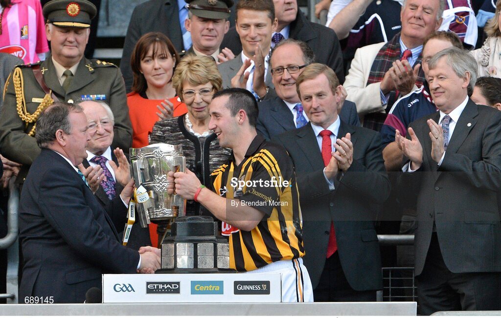 30 September 2012; Kilkenny captain Eoin Larkin is presented with the Liam MacCarthy cup by Uachtarán Chumann Lúthchleas Gael Liam Ó Néill, in the company of President of Ireland Michael D Higgins, An Taoiseach Enda Kenny TD, and Ard Stiúrthóir of the GAA Páraic Duffy. GAA Hurling All-Ireland Senior Championship Final Replay, Kilkenny v Galway, Croke Park, Dublin. Picture credit: Brendan Moran / SPORTSFILE