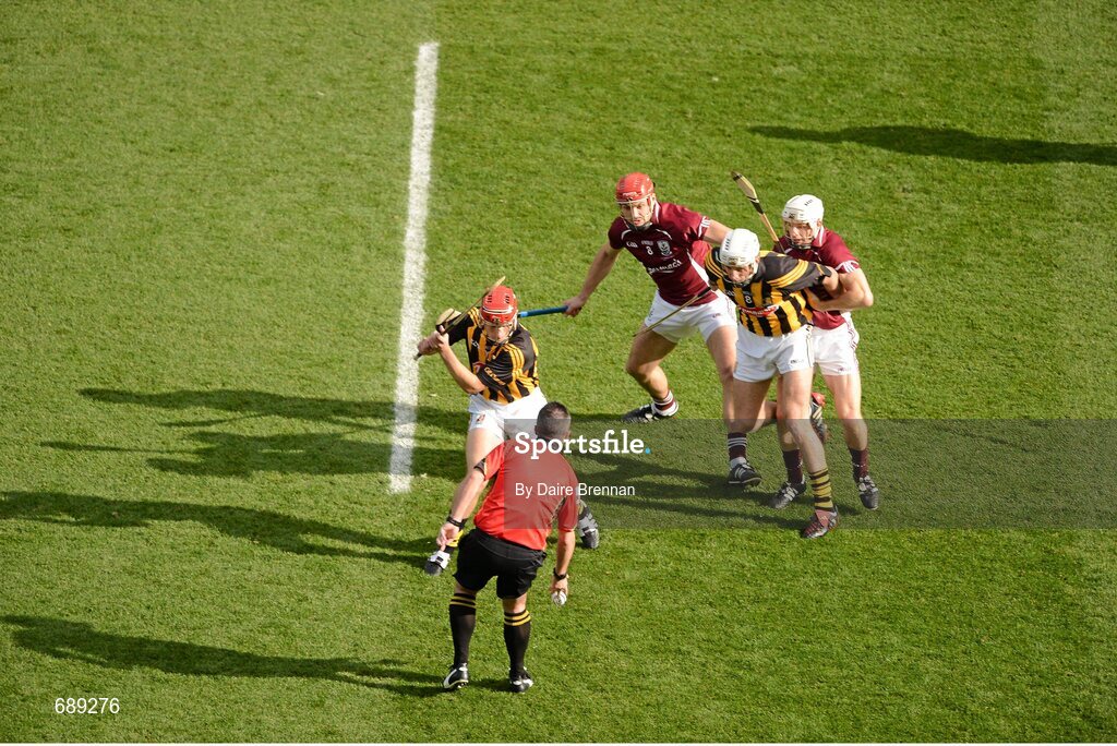 30 September 2012; Referee James McGrath throws in the ball to start the game between Kilkenny players Cillian Buckley, left, and Michael Fennelly, and Galway players, Iarla Tannian, left, and Andy Smith. GAA Hurling All-Ireland Senior Championship Final Replay, Kilkenny v Galway, Croke Park, Dublin. Picture credit: Daire Brennan / SPORTSFILE