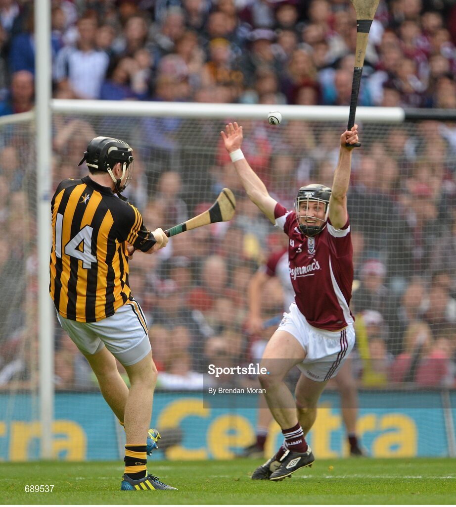 30 September 2012; Walter Walsh, Kilkenny, scores a point despite the efforts of Kevin Hynes, Galway. GAA Hurling All-Ireland Senior Championship Final Replay, Kilkenny v Galway, Croke Park, Dublin. Picture credit: Brendan Moran / SPORTSFILE
