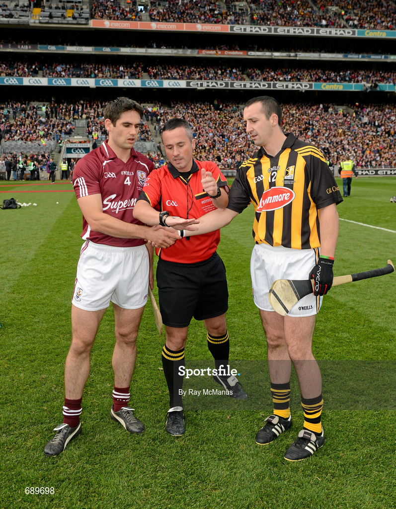 30 September 2012; Galway captain Fergal Moore and Kilkenny captain Eóin Larkin look on as referee James McGrath tosses a commemorative Michael Collins coin before the GAA Hurling All-Ireland Senior Championship Final Replay match between Kilkenny and Galway at Croke Park in Dublin. Photo by Ray McManus/Sportsfile