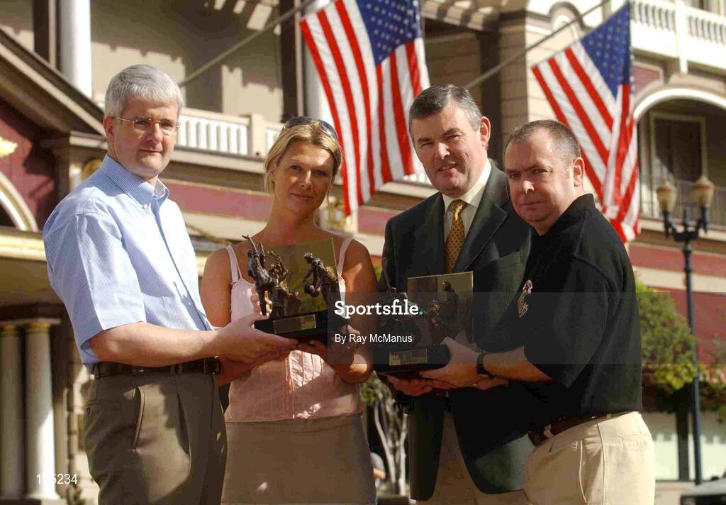 16 January 2002; All-Ireland Final referees Aodán Mac Suibhne, right, Dublin, Hurling, and John Bannon, left, Longford, Football, are presented with their Vodafone GAA All-Star Referee Awards by Tara Delaney, Director of Communications, Vodafone (Ireland) Ltd., and GAA President Sean McCague at lunch in their honour, US Grant Wyndham Hotel, Broadway, San Diego, USA. Picture credit; Ray McManus / SPORTSFILE *ED*