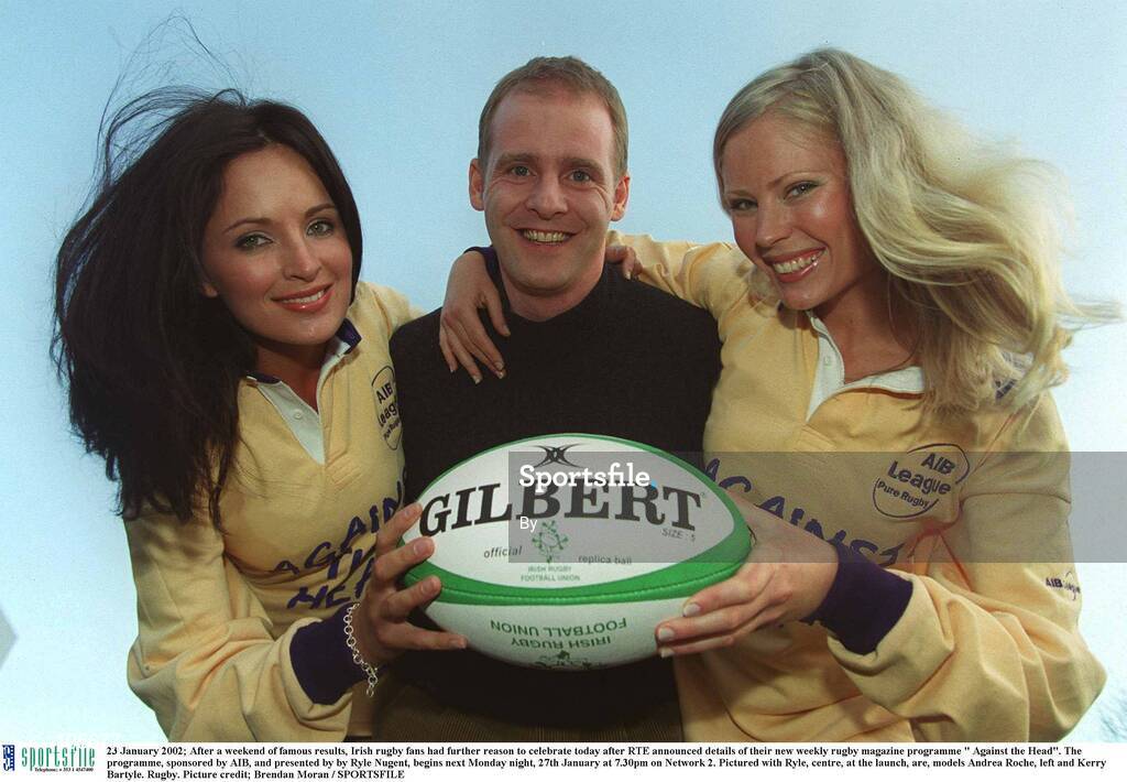 23 January 2002; After a weekend of famous results, Irish rugby fans had further reason to celebrate today after RTE announced details of their new weekly rugby magazine programme " Against the Head". The programme, sponsored by AIB, and presented by by Ryle Nugent, begins next Monday night, 27th January at 7.30pm on Network 2. Pictured with Ryle, centre, at the launch, are, models Andrea Roche, left and Kerry Bartyle. Rugby. Picture credit; Brendan Moran / SPORTSFILE