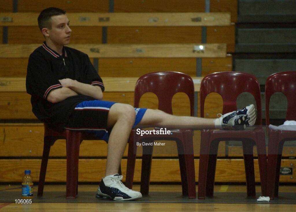 31 January 2003; David Murphy, Mardyke UCC Demons, who injured himself during the warm-up, watches on during the game. ESB National Cup 2003, Junior men semi-final, Mardyke UCC Demons v St.Brendan's, ESB Arena, Tallaght, Dublin. Basketball. Picture credit; David Maher / SPORTSFILE *EDI*