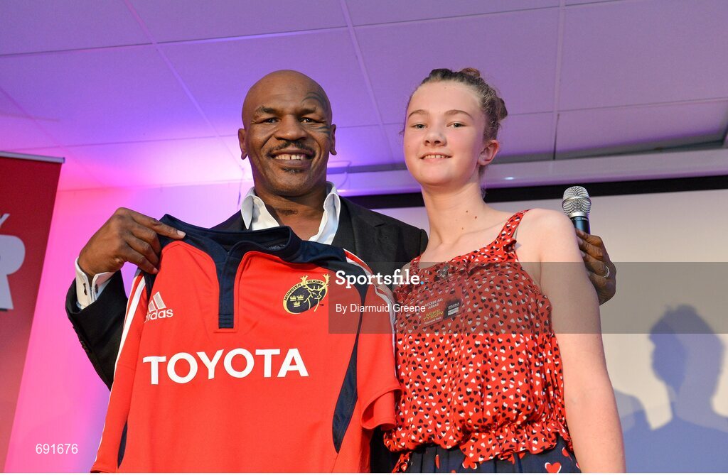 10 October 2012; Former undisputed heavyweight boxing champion Mike Tyson is presented with a Munster rugby jersey by Laura O'Regan, age 13, from Bantry, Co. Cork. Thomond Park, Limerick. Picture credit: Diarmuid Greene / SPORTSFILE