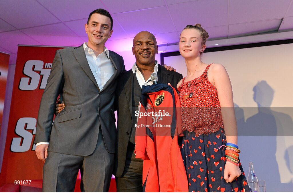 10 October 2012; Former undisputed heavyweight boxing champion Mike Tyson is presented with a Munster rugby jersey by Mike O'Regan and Laura O'Regan, age 13, from Bantry, Co. Cork. Thomond Park, Limerick. Picture credit: Diarmuid Greene / SPORTSFILE