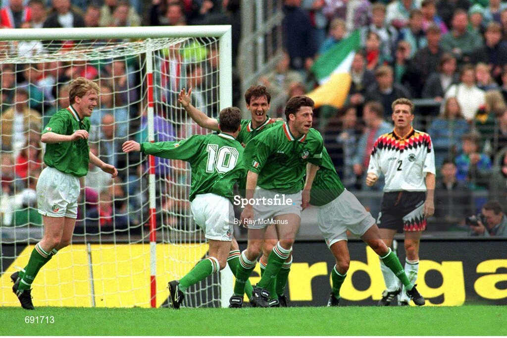 29 May 1994. Republic of Ireland's Tony Cascarino, centre, celebrates with team-mates, from left to right, Steve Staunton, John Sheridan, Andy Townsend and Terry Phelan after scoring his side's goal as Germany's Thomas Strunz looks on. Friendly International, Republic of Ireland v Germany, Stuttgart, Germany. Picture Credit: Ray McManus / SPORTSFILE