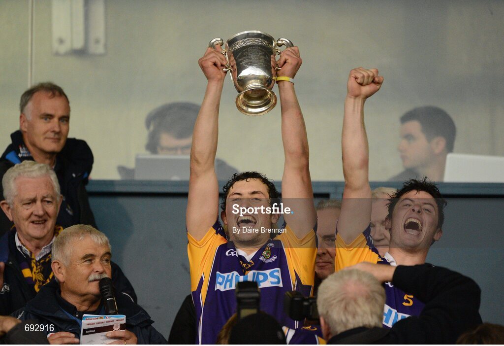 14 October 2012; Kilmacud Crokes captain Ross O'Carroll, along with his brother Bill, lifts the New Ireland Cup. Dublin County Senior Hurling Championship Final, Cuala v Kilmacud Crokes, Parnell Park, Dublin. Picture credit: Dáire Brennan / SPORTSFILE