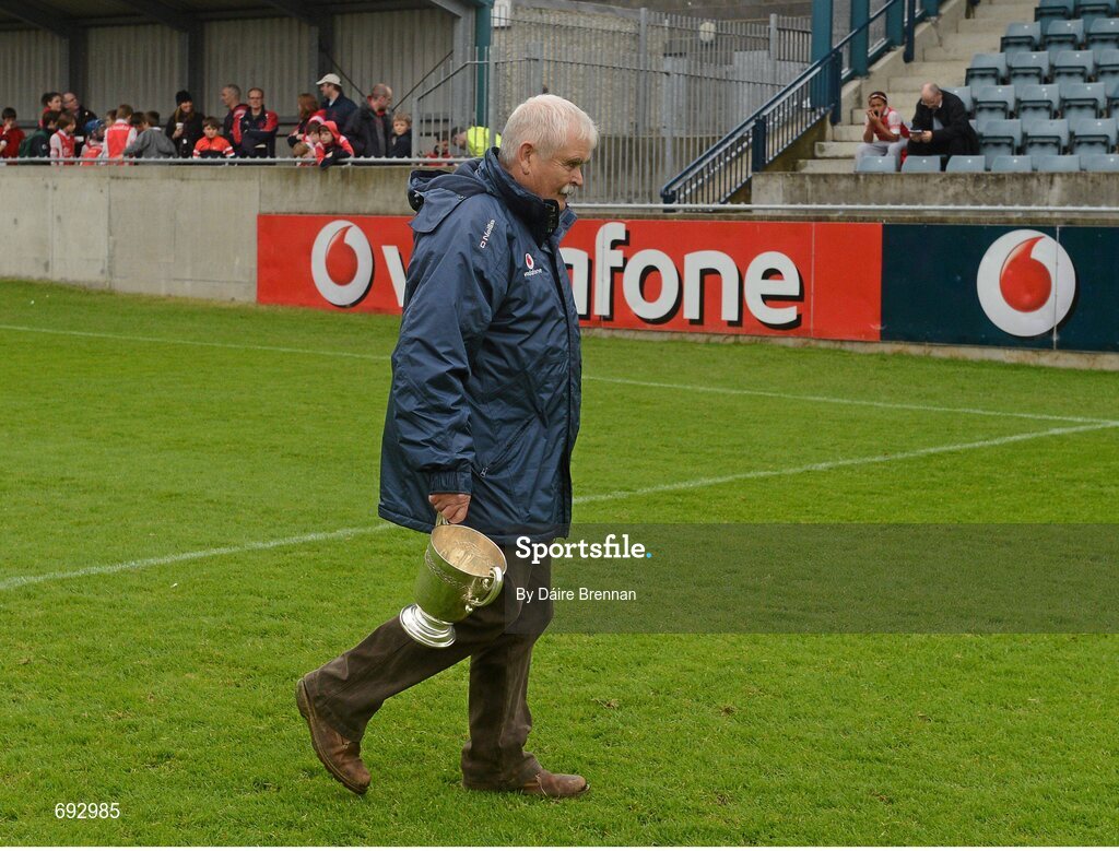 14 October 2012; Dublin county board chairman Andy Kettle, brings the New Ireland cup out before the game. Dublin County Senior Hurling Championship Final, Cuala v Kilmacud Crokes, Parnell Park, Dublin. Picture credit: Dáire Brennan / SPORTSFILE