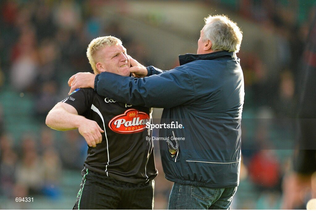 21 October 2012; James Kelly, Newcastlewest, is confronted on the pitch by a supporter shortly after he was shown a second yellow card and subsequently a red card by referee Richard Moloney. Limerick County Senior Football Championship Final, Dromcollogher Broadford v Newcastlewest, Gaelic Grounds, Limerick. Picture credit: Diarmuid Greene / SPORTSFILE