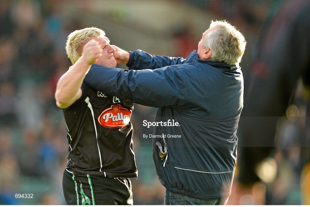 21 October 2012; James Kelly, Newcastlewest, is confronted on the pitch by a supporter shortly after he was shown a second yellow card and subsequently a red card by referee Richard Moloney. Limerick County Senior Football Championship Final, Dromcollogher Broadford v Newcastlewest, Gaelic Grounds, Limerick. Picture credit: Diarmuid Greene / SPORTSFILE