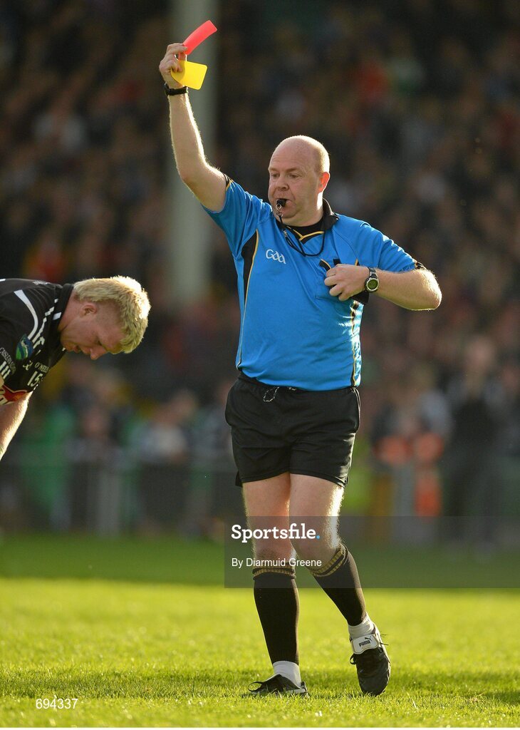 21 October 2012; Referee Richard Moloney issues a second yellow and subsequent red card to James Kelly, Newcastlewest. Limerick County Senior Football Championship Final, Dromcollogher Broadford v Newcastlewest, Gaelic Grounds, Limerick. Picture credit: Diarmuid Greene / SPORTSFILE