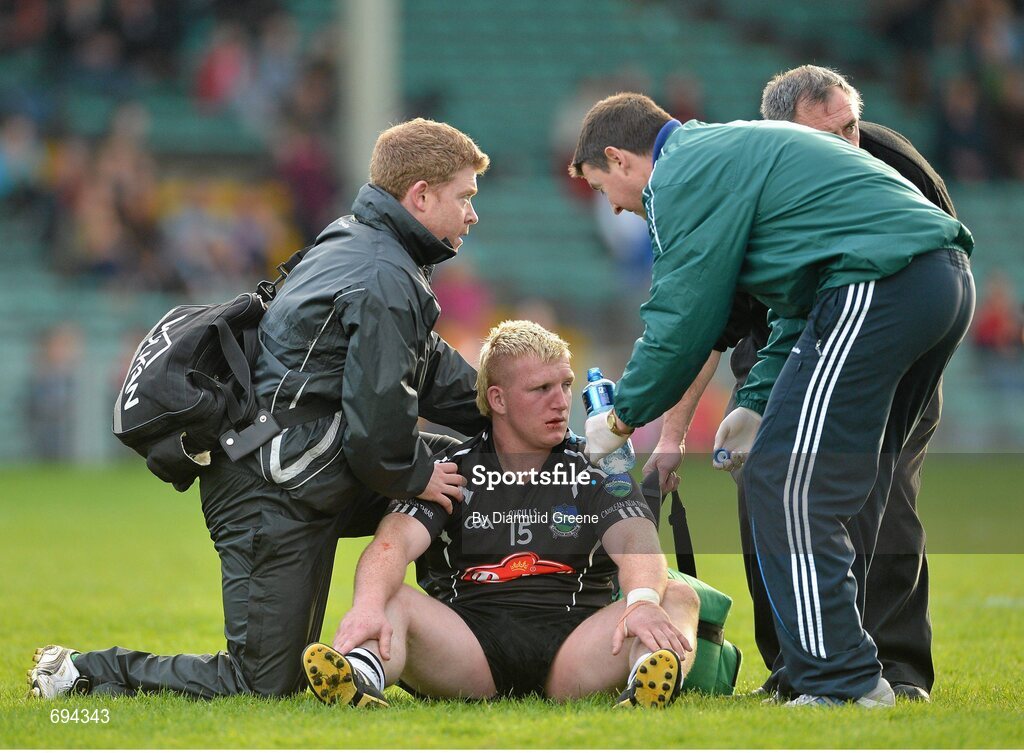 21 October 2012; James Kelly of Newcastlewest receives attention following an incident involving a supporter. Limerick County Senior Football Championship Final, Dromcollogher Broadford v Newcastlewest, Gaelic Grounds, Limerick. Picture credit: Diarmuid Greene / SPORTSFILE