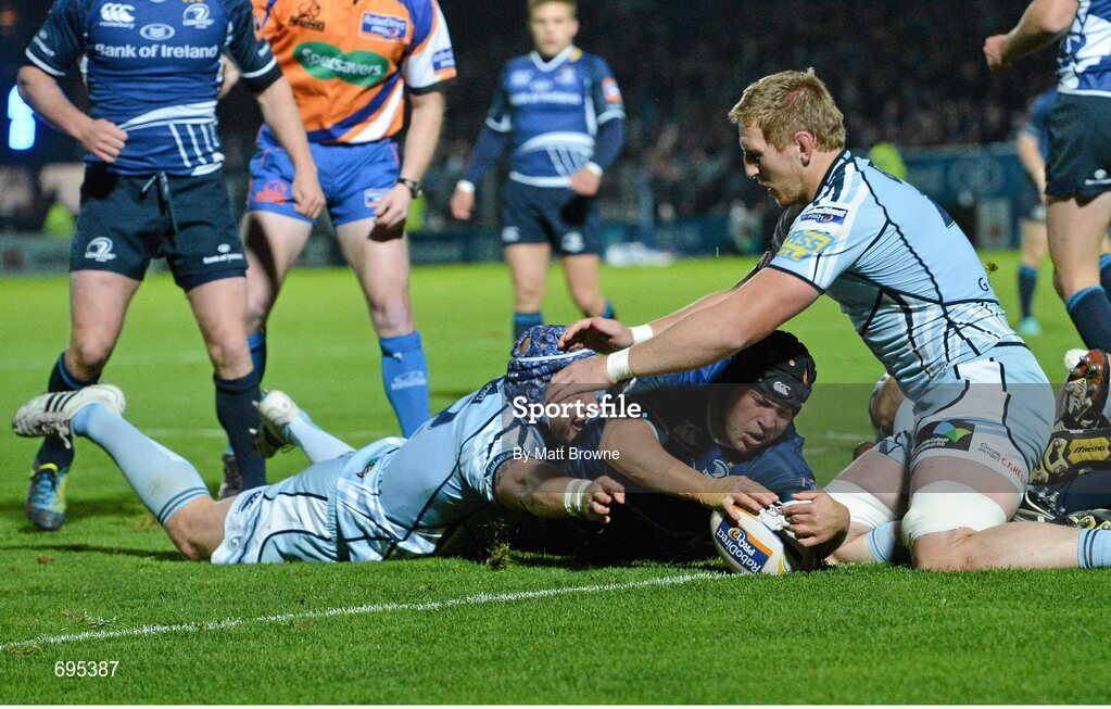 27 October 2012; Richardt Strauss, Leinster, goes over to score his side's first try despite the tackle of Marc Breeze, Cardiff Blues. Celtic League 2012/13, Round 7, Leinster v Cardiff Blues, RDS, Ballsbridge, Dublin. Picture credit: Matt Browne / SPORTSFILE