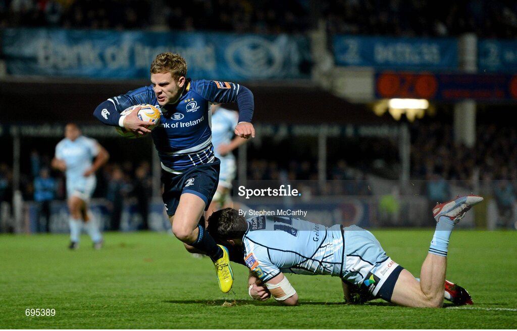 27 October 2012; Ian Madigan, Leinster, goes over for his side's second try, despite the tackle of Alex Cuthbert, Cardiff Blues. Celtic League 2012/13, Round 7, Leinster v Cardiff Blues, RDS, Ballsbridge, Dublin. Picture credit: Stephen McCarthy / SPORTSFILE