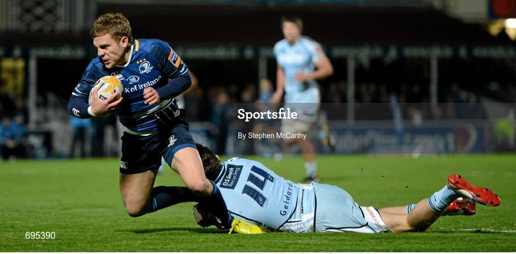 27 October 2012; Ian Madigan, Leinster, goes over for his side's second try, despite the tackle of Alex Cuthbert, Cardiff Blues. Celtic League 2012/13, Round 7, Leinster v Cardiff Blues, RDS, Ballsbridge, Dublin. Picture credit: Stephen McCarthy / SPORTSFILE
