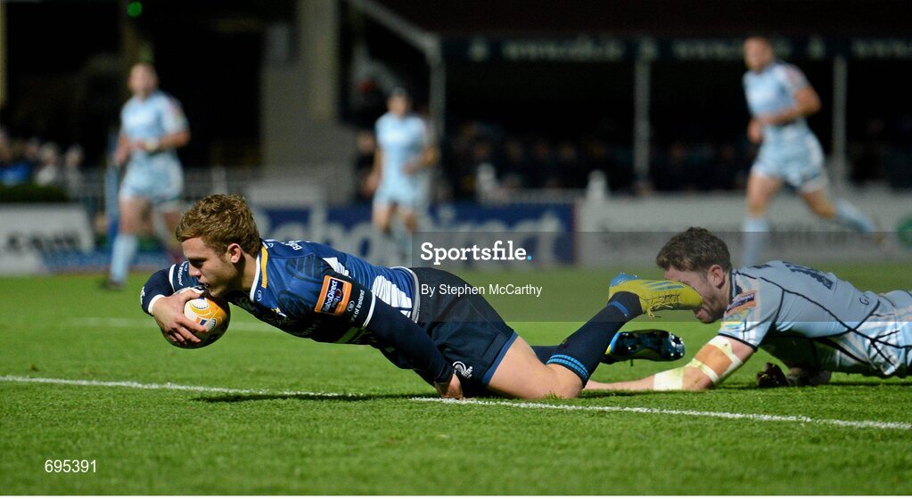 27 October 2012; Ian Madigan, Leinster, goes over for his side's second try, despite the tackle of Alex Cuthbert, Cardiff Blues. Celtic League 2012/13, Round 7, Leinster v Cardiff Blues, RDS, Ballsbridge, Dublin. Picture credit: Stephen McCarthy / SPORTSFILE
