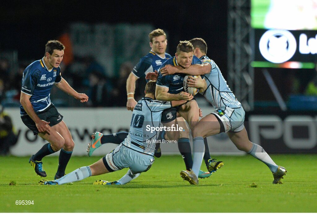 27 October 2012; Brian O'Driscoll, Leinster, is tackled by Jason Tovey, left, and Jamie Roberts, Cardiff Blues. Celtic League 2012/13, Round 7, Leinster v Cardiff Blues, RDS, Ballsbridge, Dublin. Picture credit: Matt Browne / SPORTSFILE