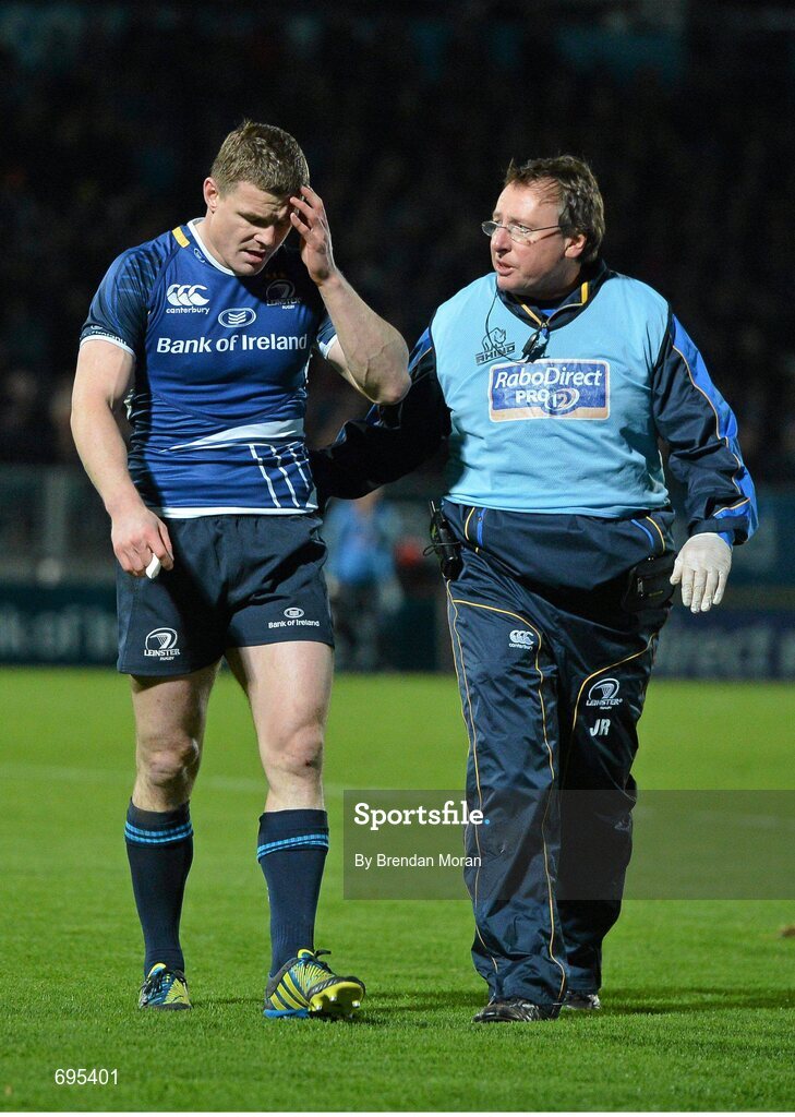 27 October 2012; Leinster's Brian O'Driscoll, leaves the pitch with an injury accompanied by team doctor John Ryan. Celtic League 2012/13, Round 7, Leinster v Cardiff Blues, RDS, Ballsbridge, Dublin. Picture credit: Brendan Moran / SPORTSFILE