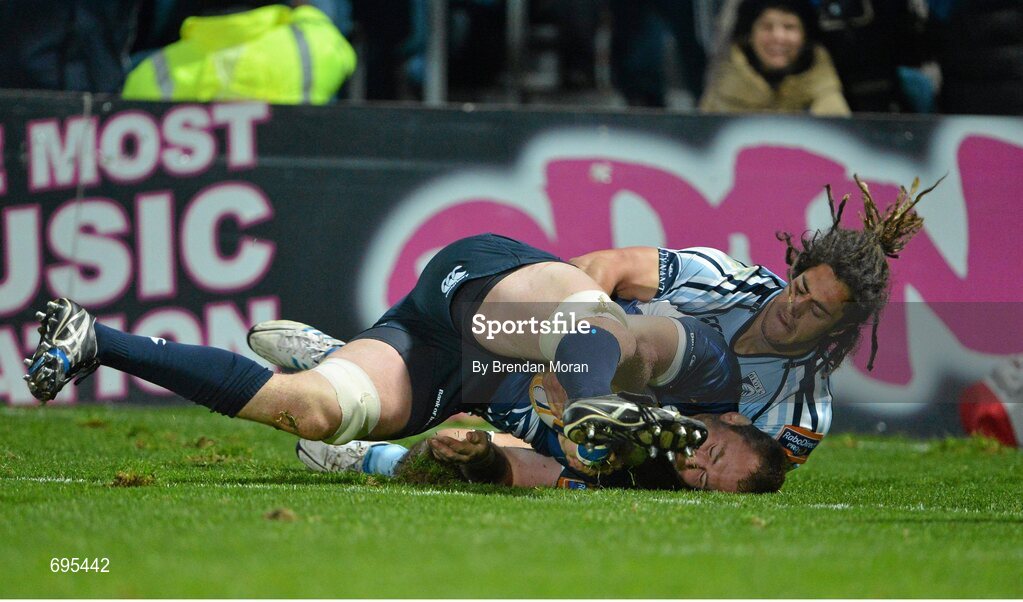 27 October 2012; Damian Browne, Leinster, goes over to score his side's eight try despite the tackle of Josh Navidi, Cardiff Blues. Celtic League 2012/13, Round 7, Leinster v Cardiff Blues, RDS, Ballsbridge, Dublin. Picture credit: Brendan Moran / SPORTSFILE
