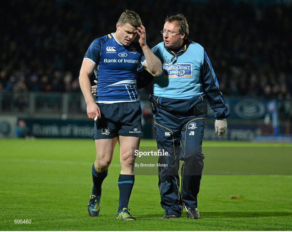 27 October 2012; Leinster's Brian O'Driscoll leaves the pitch with an injury accompanied by team doctor John Ryan. Celtic League 2012/13, Round 7, Leinster v Cardiff Blues, RDS, Ballsbridge, Dublin. Picture credit: Brendan Moran / SPORTSFILE