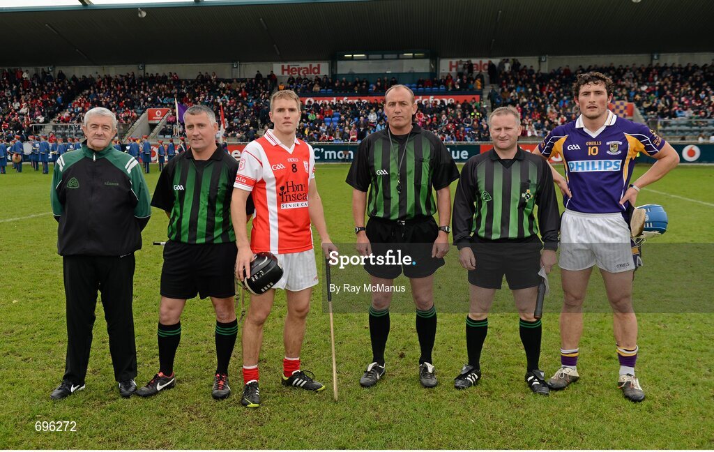 14 October 2012; Bobby Browne, Cuala, left, and Ross O'Carroll, Kilmacud Crokes, with referee Peadar Behan and his umpires before the Dublin County Senior Hurling Championship Final match between Cuala and Kilmacud Crokes at Parnell Park in Dublin. Photo by Ray McManus/Sportsfile