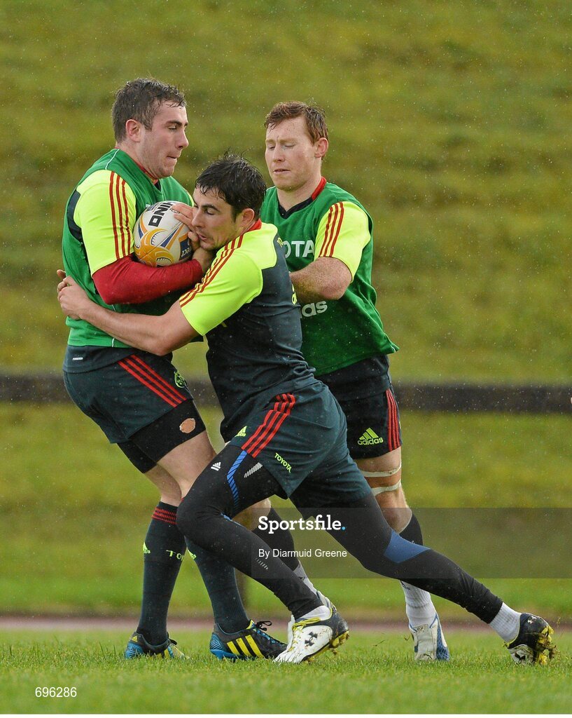 31 October 2012; Munster's JJ Hanrahan is tackled by Felix Jones during squad training ahead of their side's Celtic League 2012/13, Round 8, match against Cardiff Blues on Friday. Munster Rugby Squad Training, University of Limerick, Limerick. Picture credit: Diarmuid Greene / SPORTSFILE