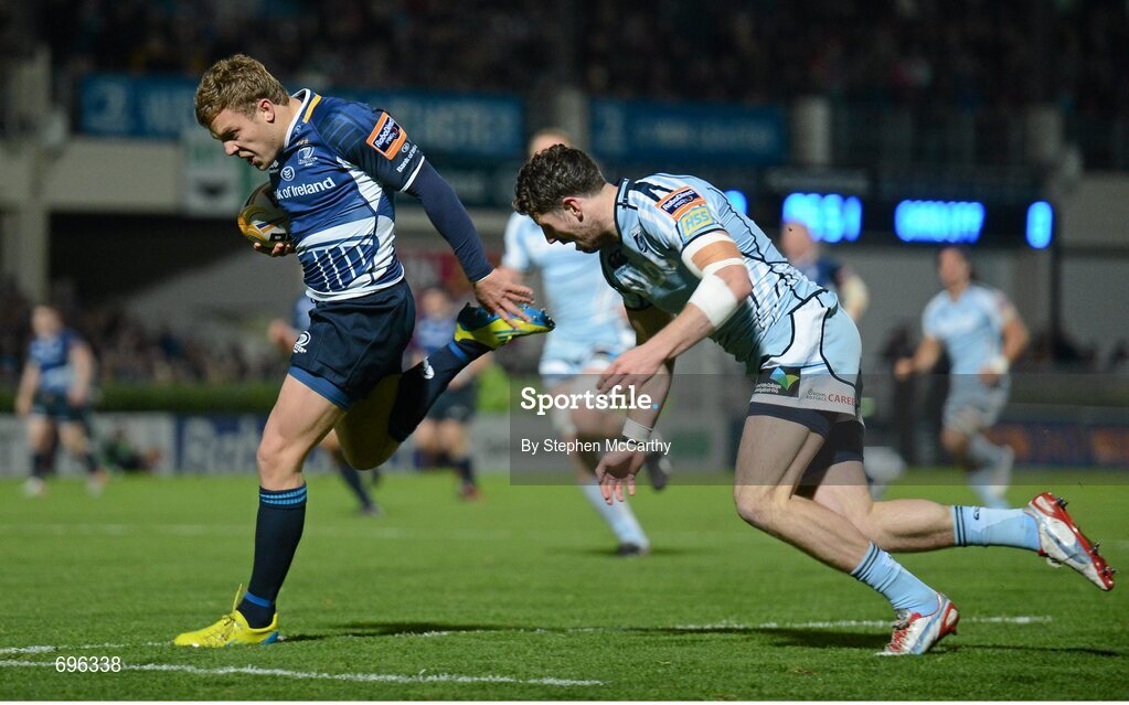 27 October 2012; Ian Madigan, Leinster, goes over for his side's second try, despite the tackle of Alex Cuthbert, Cardiff Blues. Celtic League 2012/13, Round 7, Leinster v Cardiff Blues, RDS, Ballsbridge, Dublin. Picture credit: Stephen McCarthy / SPORTSFILE