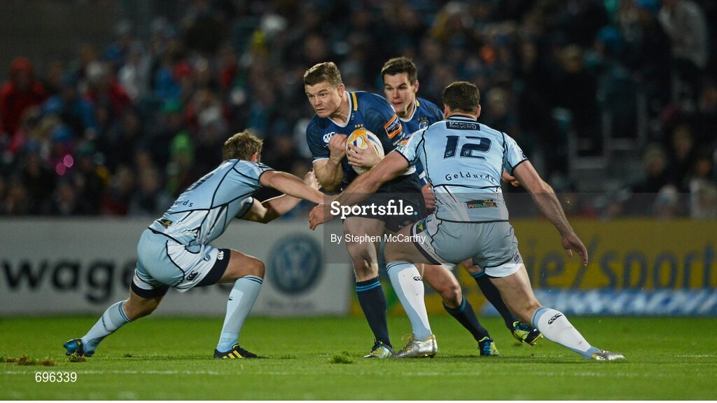 27 October 2012; Brian O'Driscoll, Leinster, is tackled by Jason Tovey, left, and Jamie Roberts, Cardiff Blues. Celtic League 2012/13, Round 7, Leinster v Cardiff Blues, RDS, Ballsbridge, Dublin. Picture credit: Stephen McCarthy / SPORTSFILE
