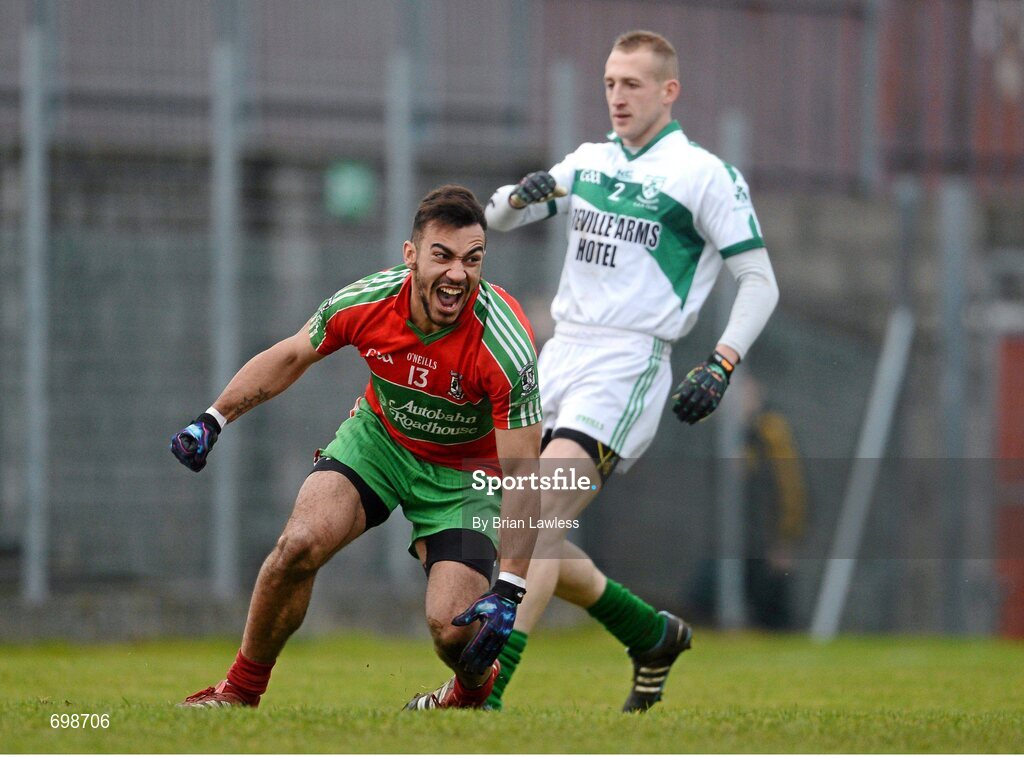 11 November 2012; Ted Furman, Ballymun Kickhams, celebrates scoring his side's second goal as Eddie Moore, Mullingar Shamrocks, looks on. AIB Leinster GAA Football Senior Championship Quarter-Final, Mullingar Shamrocks, Westmeath v Ballymun Kickhams, Dublin, Cusack Park, Mullingar, Co. Westmeath. Picture credit: Brian Lawless / SPORTSFILE