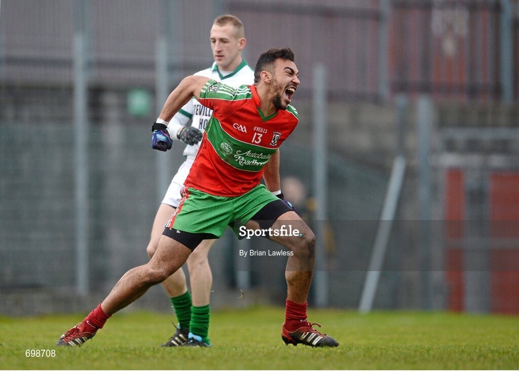 11 November 2012; Ted Furman, Ballymun Kickhams, celebrates scoring his side's second goal as Eddie Moore, Mullingar Shamrocks, looks on. AIB Leinster GAA Football Senior Championship Quarter-Final, Mullingar Shamrocks, Westmeath v Ballymun Kickhams, Dublin, Cusack Park, Mullingar, Co. Westmeath. Picture credit: Brian Lawless / SPORTSFILE