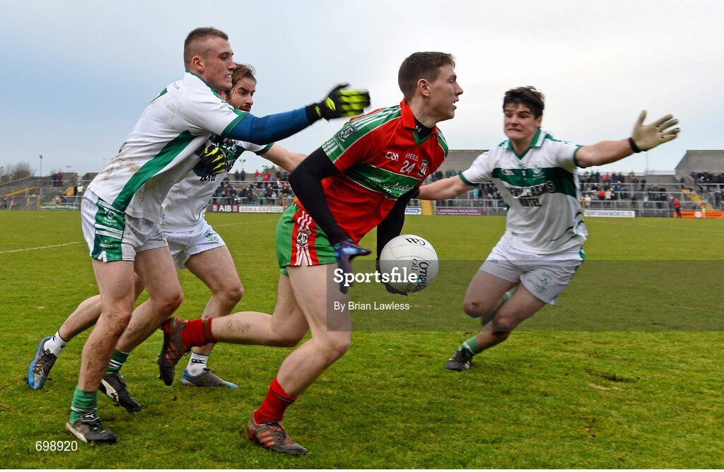 11 November 2012; John Small, Ballymun Kickhams, in action against, from left, Paddy Joyce, Aonhus Smyth, and David Gavin, Mullingar Shamrocks. AIB Leinster GAA Football Senior Championship Quarter-Final, Mullingar Shamrocks, Westmeath v Ballymun Kickhams, Dublin, Cusack Park, Mullingar, Co. Westmeath. Picture credit: Brian Lawless / SPORTSFILE