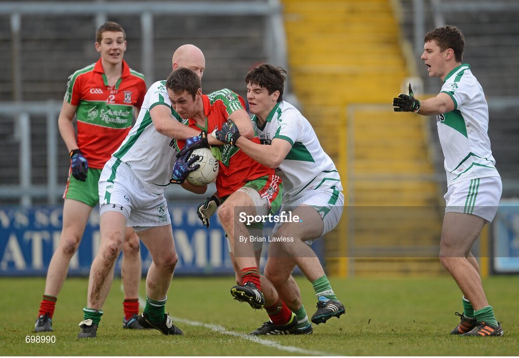 11 November 2012; Andy O'Brien, Ballymun Kickhams, in action against, from left, Donal O'Donoghue, David Gavin, and Kieran Gavin, Mullingar Shamrocks. AIB Leinster GAA Football Senior Championship Quarter-Final, Mullingar Shamrocks, Westmeath v Ballymun Kickhams, Dublin, Cusack Park, Mullingar, Co. Westmeath. Picture credit: Brian Lawless / SPORTSFILE