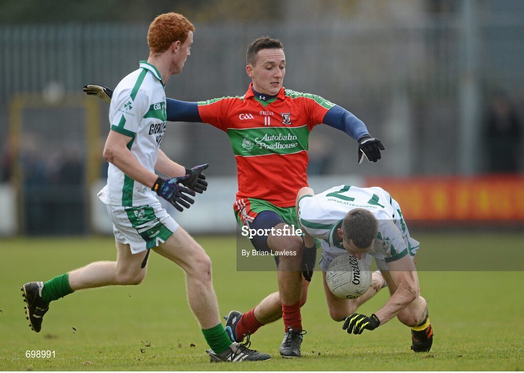 11 November 2012; Anthony Clinton and Sean Daly, left, Mullingar Shamrocks, in action against Kevin Leahy, Ballymun Kickhams. AIB Leinster GAA Football Senior Championship Quarter-Final, Mullingar Shamrocks, Westmeath v Ballymun Kickhams, Dublin, Cusack Park, Mullingar, Co. Westmeath. Picture credit: Brian Lawless / SPORTSFILE