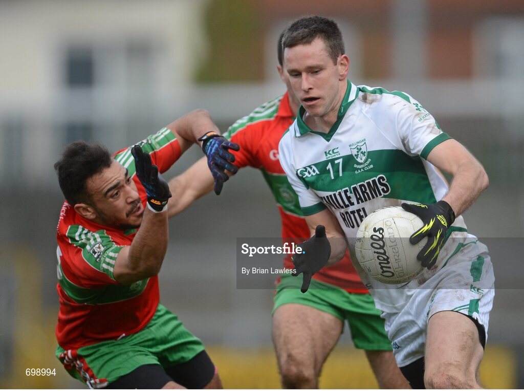 11 November 2012; Anthony Clinton, Mullingar Shamrocks, in action against Ted Furman, left, and James Burke, Ballymun Kickhams. AIB Leinster GAA Football Senior Championship Quarter-Final, Mullingar Shamrocks, Westmeath v Ballymun Kickhams, Dublin, Cusack Park, Mullingar, Co. Westmeath. Picture credit: Brian Lawless / SPORTSFILE