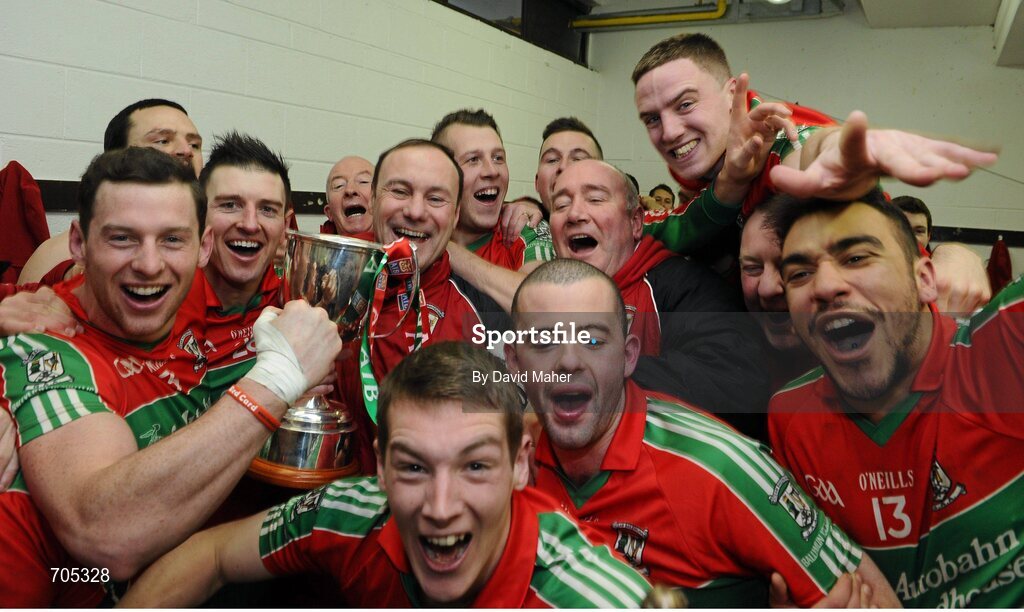9 December 2012; Ballymun Kickhams manager Paul Curran, centre, celebrates with players in the dressing room at the end of the game. AIB Leinster GAA Football Senior Club Championship Final, Portlaoise, Laois v Ballymun Kickhams, Dublin, Cusack Park, Mullingar, Co. Westmeath. Picture credit: David Maher / SPORTSFILE